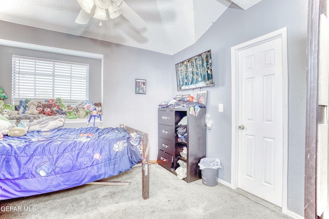 bedroom with baseboards, a ceiling fan, a textured ceiling, and carpet flooring