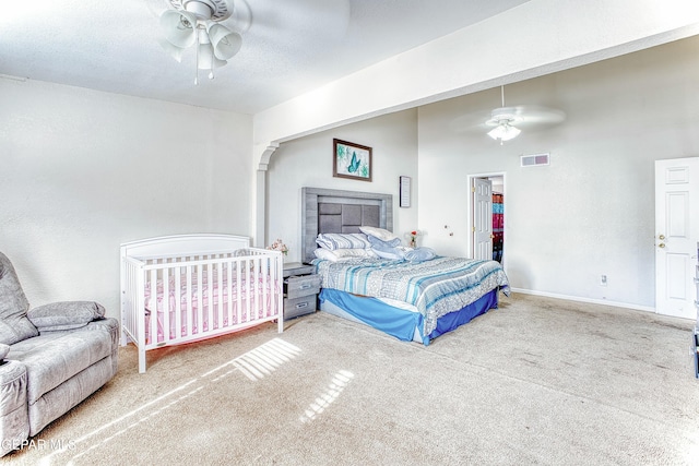 bedroom featuring carpet floors, visible vents, ceiling fan, and baseboards