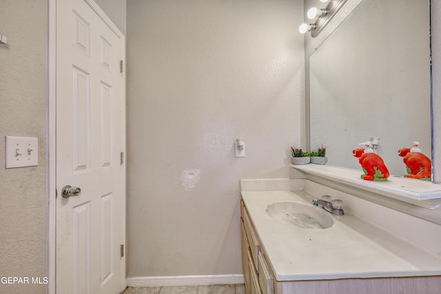 11948 Mcauliffe Dr, El Paso, TX 79936 - bathroom featuring vanity and baseboards