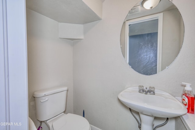 11948 Mcauliffe Dr, El Paso, TX 79936 - bathroom with toilet and a sink