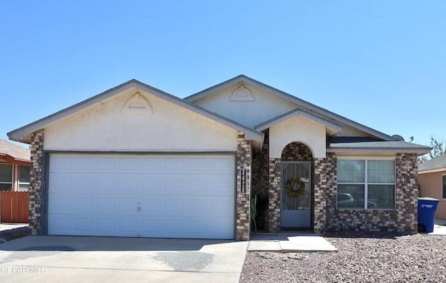 ranch-style home featuring a garage