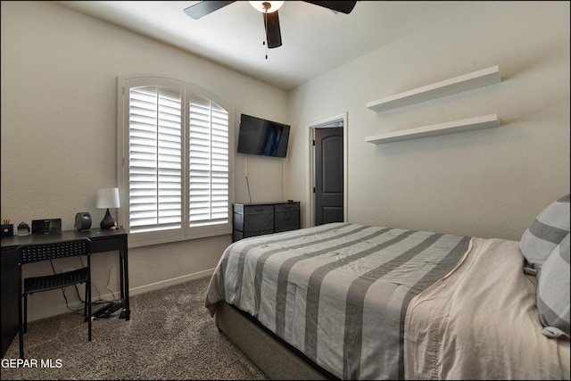 carpeted bedroom featuring multiple windows and ceiling fan