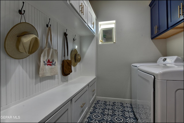 laundry area featuring tile patterned floors, cabinets, and independent washer and dryer