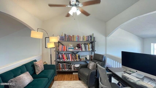 office featuring a textured ceiling, light hardwood / wood-style flooring, and ceiling fan