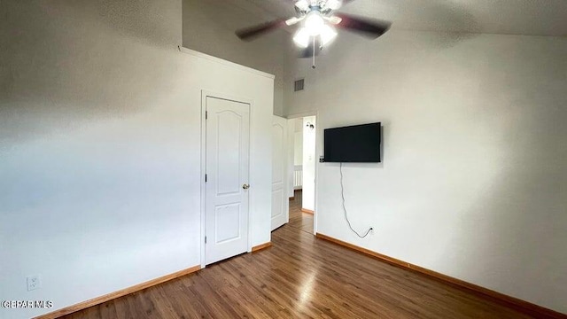 unfurnished bedroom featuring hardwood / wood-style floors and ceiling fan