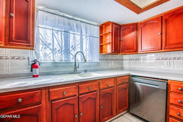 kitchen featuring dishwasher, sink, backsplash, a textured ceiling, and light tile patterned flooring