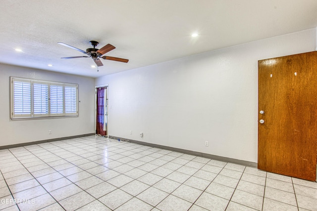 spare room with ceiling fan