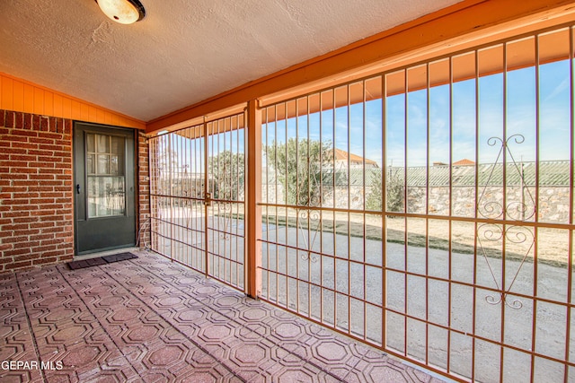 unfurnished sunroom with vaulted ceiling