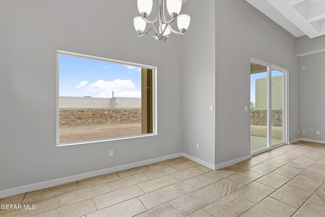 unfurnished dining area featuring a wealth of natural light and a chandelier