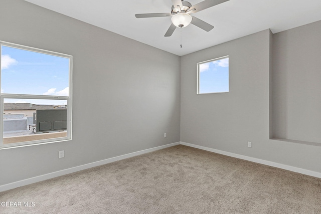 empty room with light carpet and ceiling fan