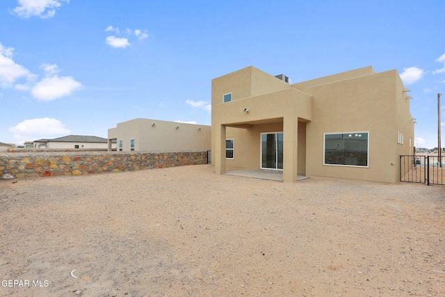 back of house with a patio area