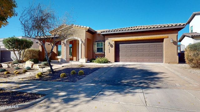 mediterranean / spanish house featuring a garage