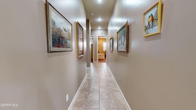 corridor featuring light tile patterned floors