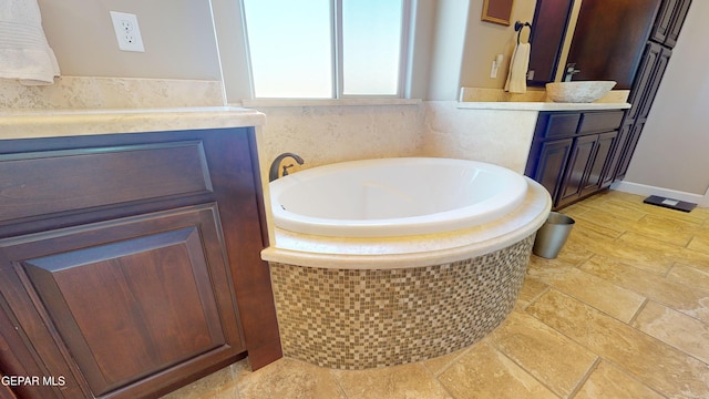 bathroom with vanity and a bathing tub