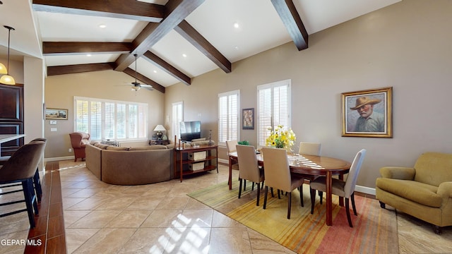 tiled dining room featuring ceiling fan, beam ceiling, and high vaulted ceiling