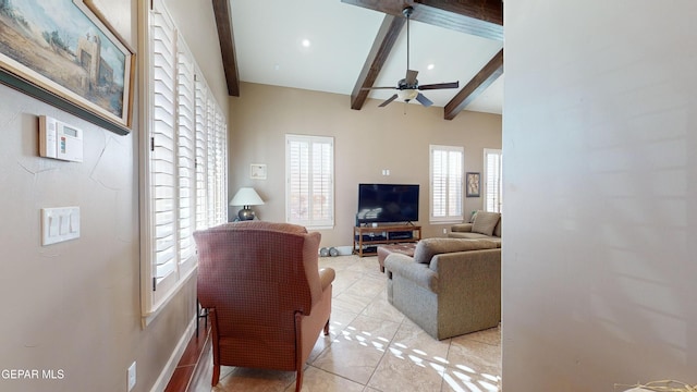 tiled living room with ceiling fan and lofted ceiling with beams