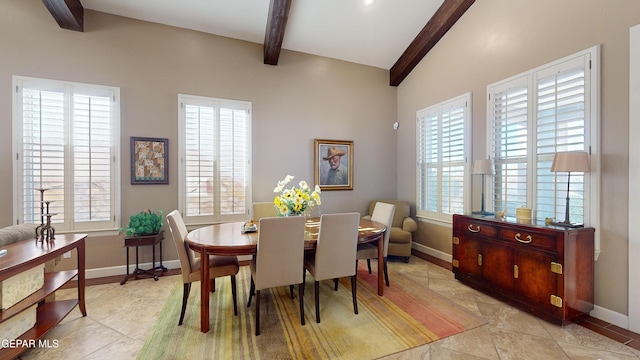 dining area with vaulted ceiling with beams, a wealth of natural light, and light tile patterned flooring