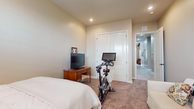 carpeted bedroom featuring a closet