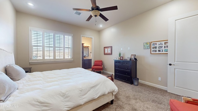 bedroom with ceiling fan and light carpet