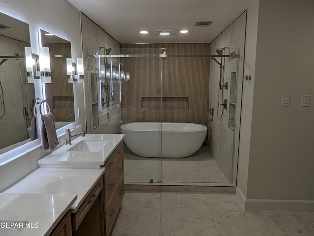 bathroom with tile patterned floors, vanity, and independent shower and bath