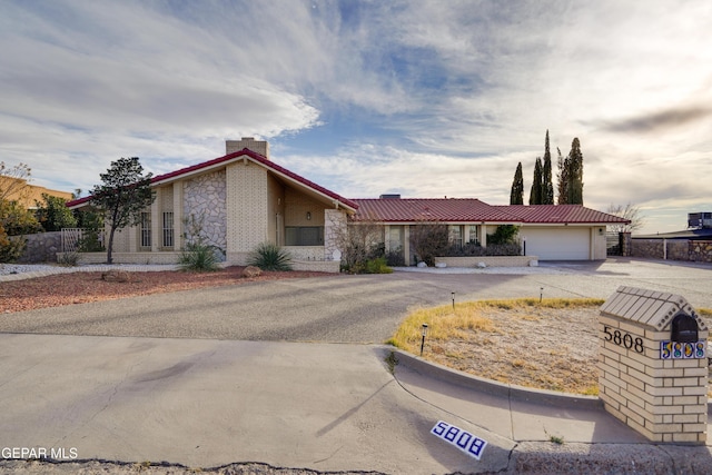 ranch-style house featuring a garage