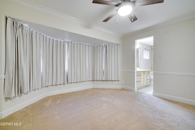 unfurnished room with light colored carpet, ceiling fan, and ornamental molding