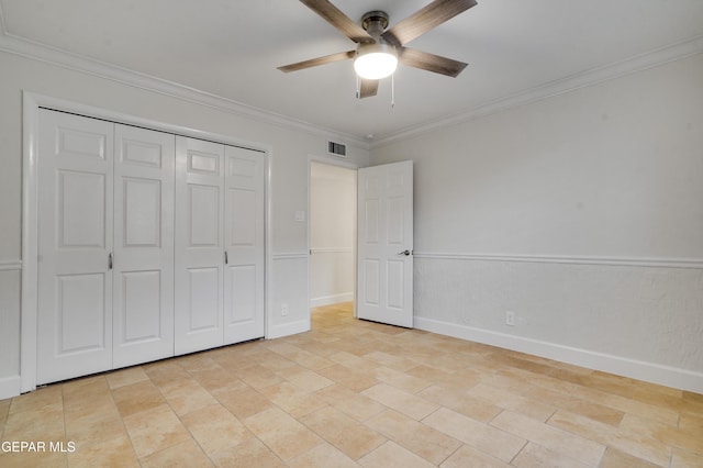 unfurnished bedroom featuring a closet, ceiling fan, and crown molding