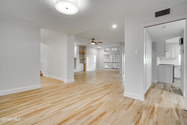 unfurnished living room with light hardwood / wood-style flooring, ceiling fan, and crown molding