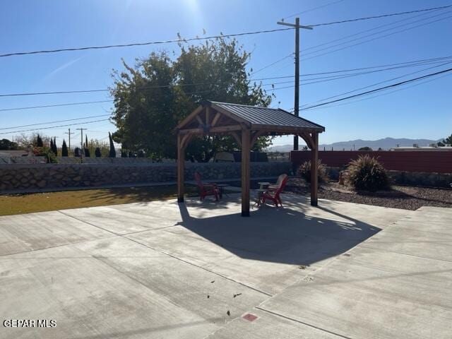 view of patio featuring a gazebo and a mountain view