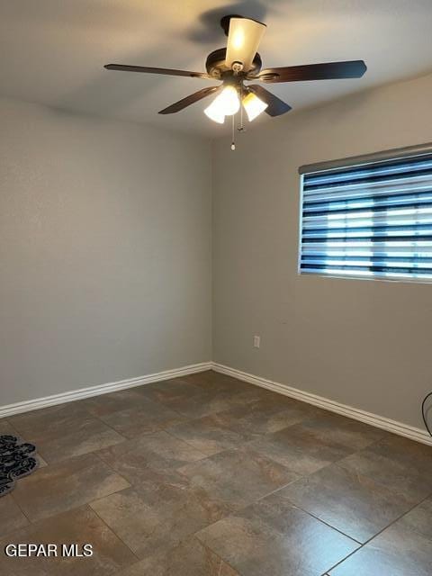 unfurnished room with ceiling fan