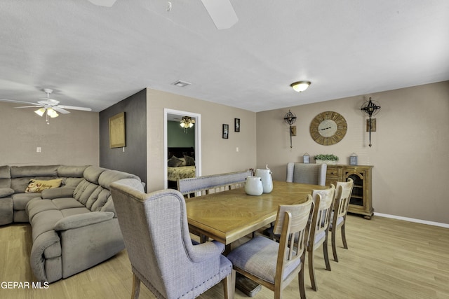 dining space with light hardwood / wood-style flooring