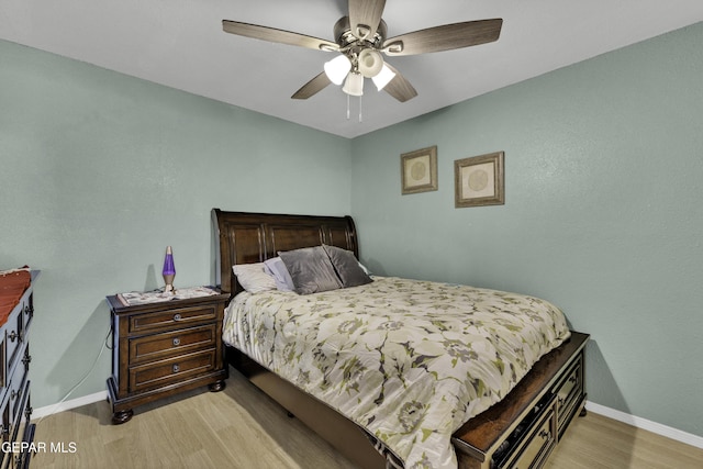 bedroom with ceiling fan and light wood-type flooring