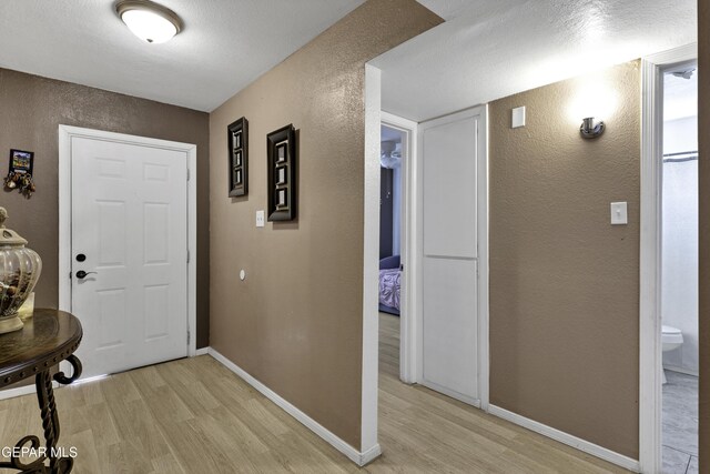 foyer entrance with light hardwood / wood-style floors