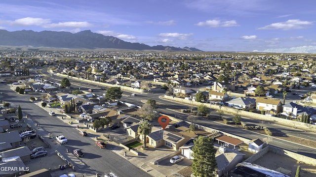 birds eye view of property featuring a mountain view