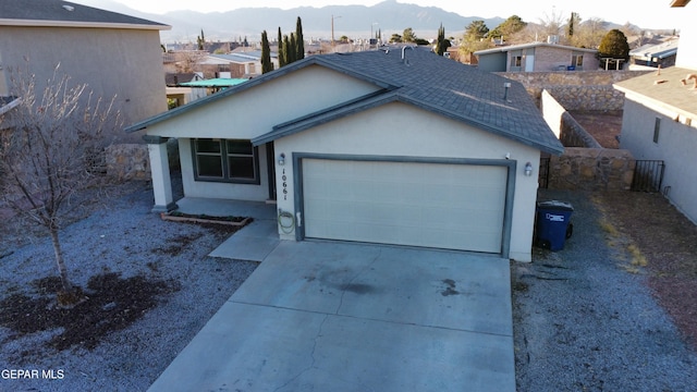 ranch-style house featuring a mountain view and a garage