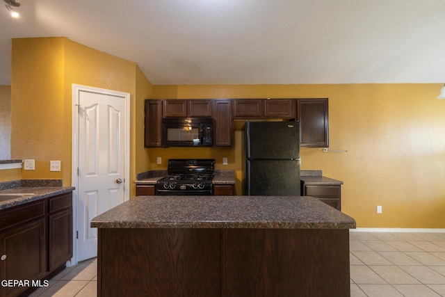 kitchen with a center island, light tile patterned flooring, black appliances, and dark brown cabinets