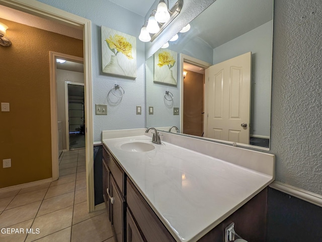 bathroom with tile patterned floors and vanity