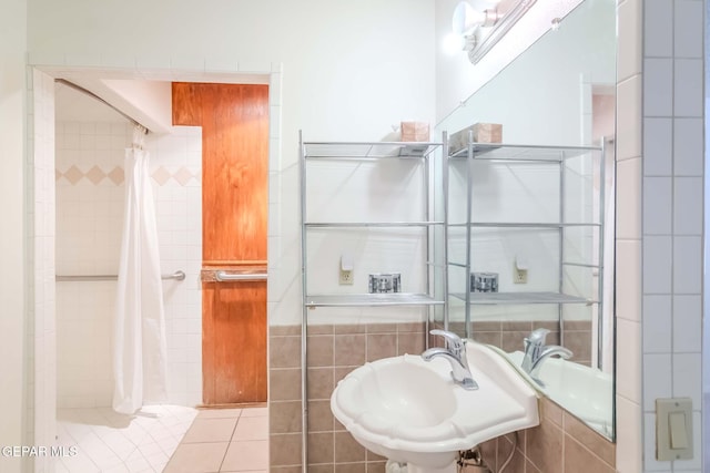 bathroom with tile patterned flooring and sink