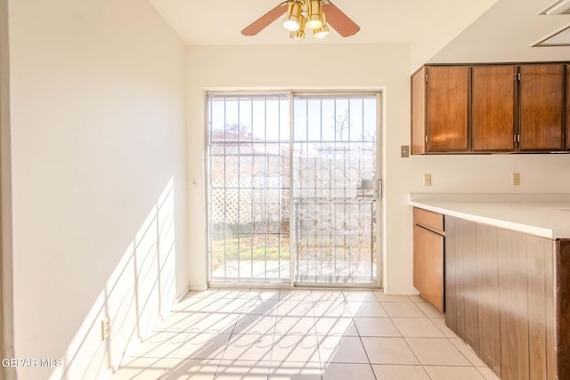 kitchen featuring ceiling fan and light tile patterned flooring