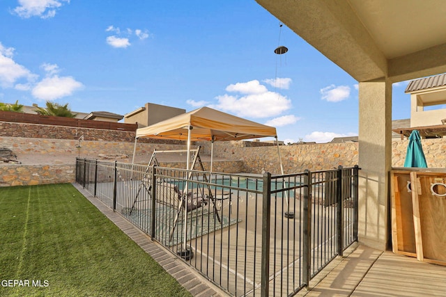 exterior space with a fenced in pool