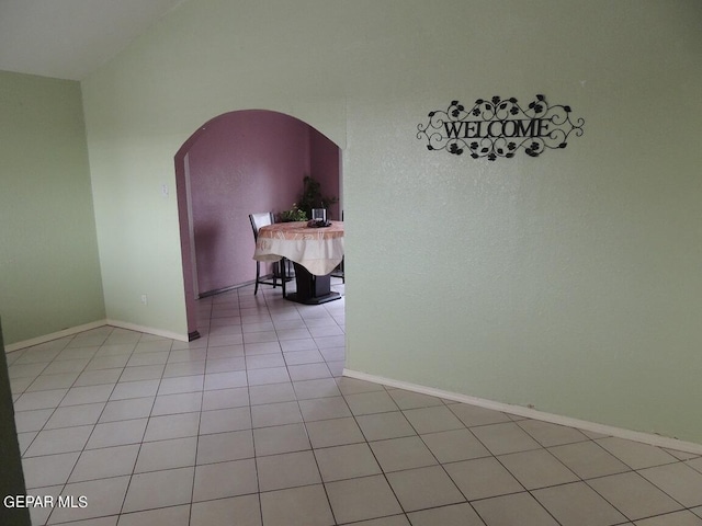 spare room featuring light tile patterned flooring