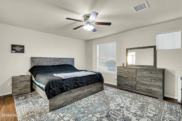 bedroom with ceiling fan and wood-type flooring