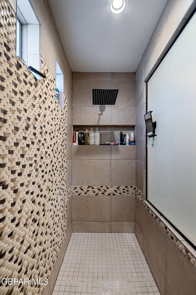 bathroom featuring tiled shower