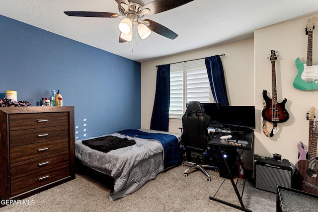 bedroom with ceiling fan and light carpet