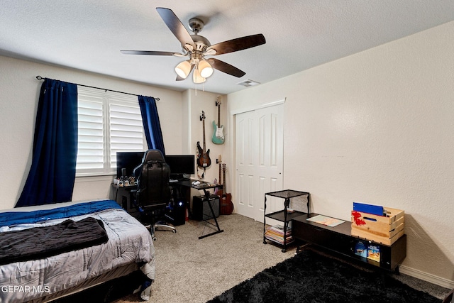 bedroom with carpet flooring, a closet, and ceiling fan