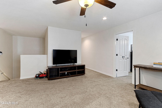 living room with light carpet and ceiling fan