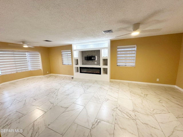 unfurnished living room featuring a textured ceiling