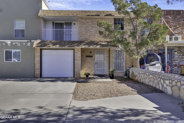 view of front facade with a garage and a balcony