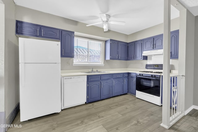 kitchen featuring white appliances, blue cabinets, ceiling fan, sink, and light hardwood / wood-style floors