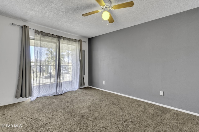 unfurnished room featuring ceiling fan, carpet floors, and a textured ceiling